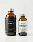 Two bottles of Reborn Prana and Reborn Pure Breath on a white background